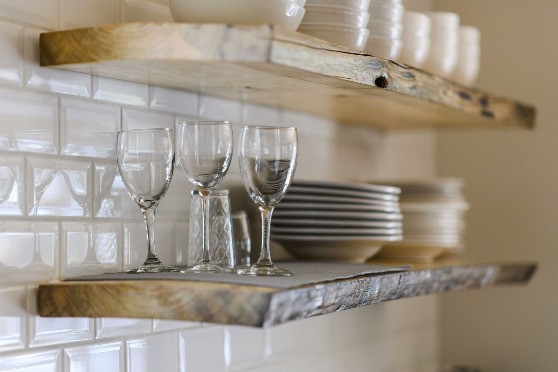 Kitchen shelves with wine glasses and dishes