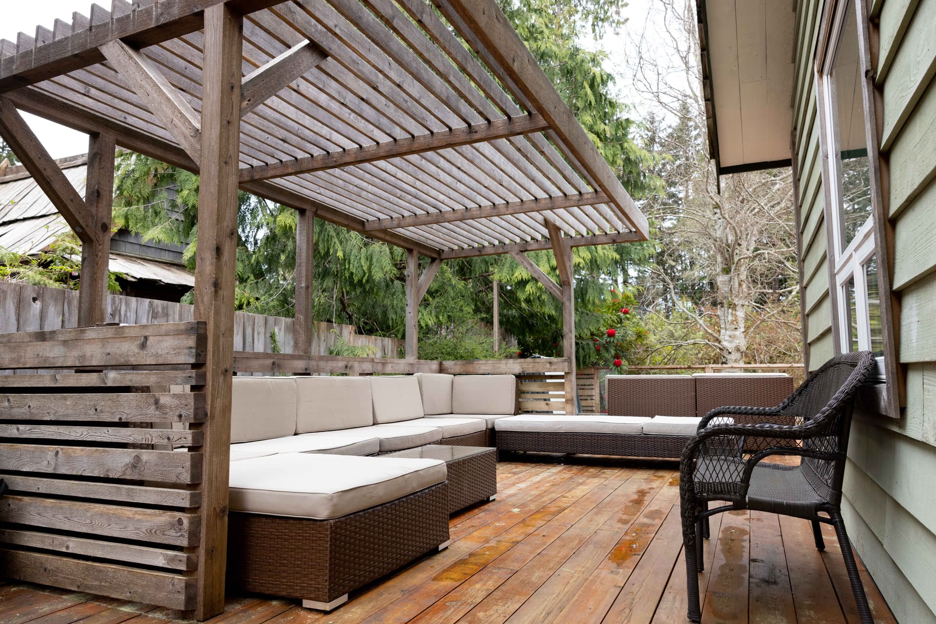 Covered pergola deck with sectional seating