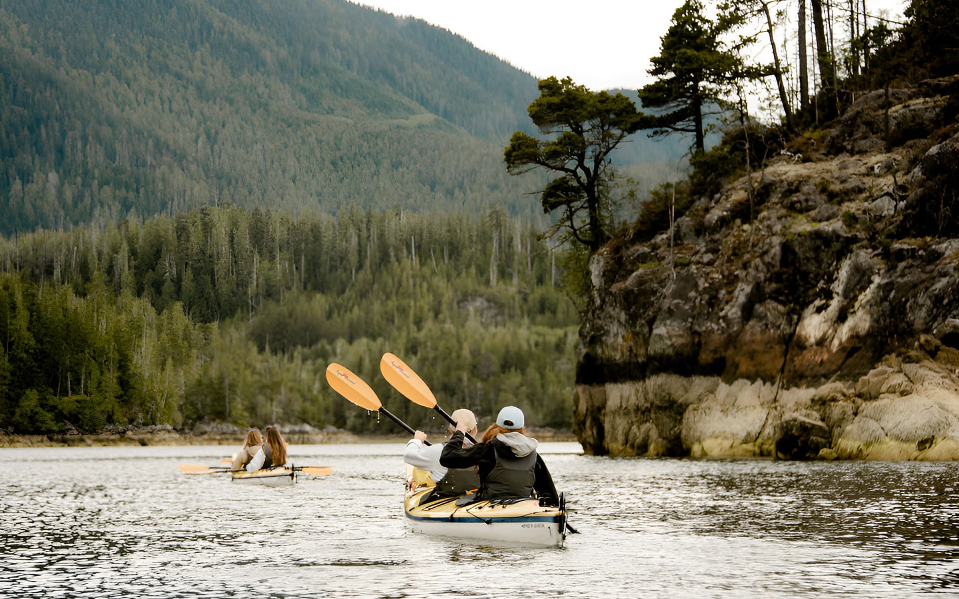 Sea kayaking on calm ocean waters in Canada